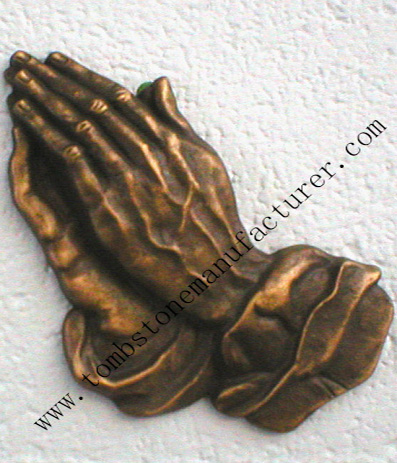 bronze praying hands